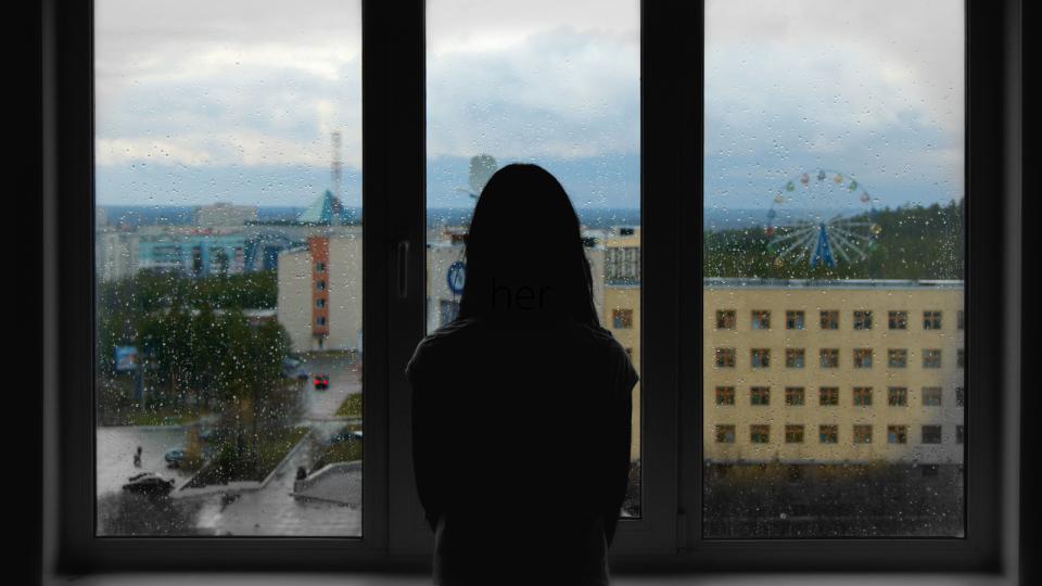 woman looking out of a window