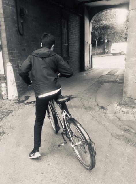 boy collecting bike from Multi-Cultural Family Base